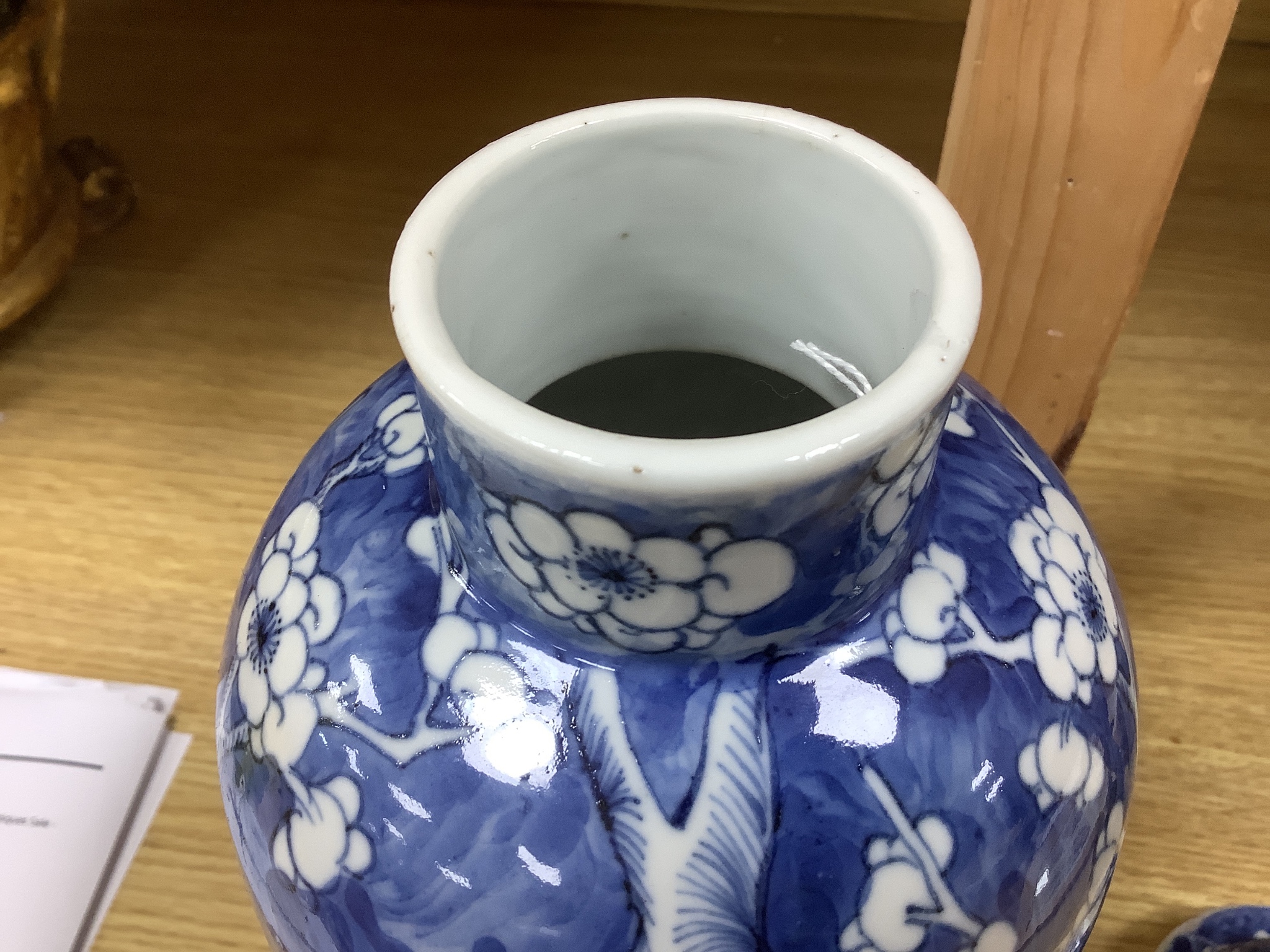 A 19th century Chinese blue and white 'prunus' vase and cover, height 33cm